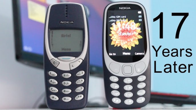 Obraz przedstawiający nowoczesny smartfon obok klasycznej Nokii 3310, symbolizujący kontrast między starymi a nowymi technologiami.